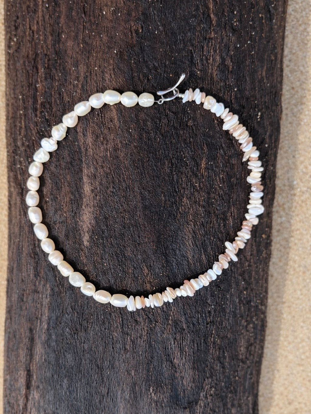 Pearl bracelet on a wooden surface